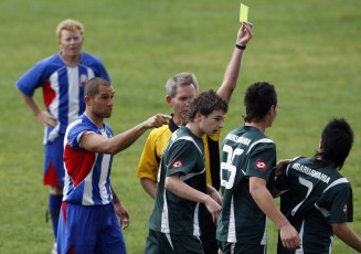 Papakura's Phil Parker (left) is a tad annoyed about Ngaruawahia's Tim Kautai's (right) tackle on Shane Godden (background) as referee John McCoskrie gives Kautai a yellow card for the tackle. Football NRFL Northern Region Football League 1st Division Papakura City FC v Ngaruawahia AFC Saturday 18th July 2009. Photo Credit: Shane Wenzlick