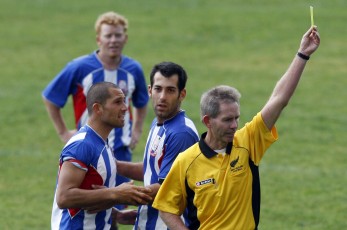 Papakura's Phil Parker (left) takes it further with referee John McCoskrie. Football NRFL Northern Region Football League 1st Division Papakura City FC v Ngaruawahia AFC Saturday 18th July 2009. Photo Credit: Shane Wenzlick
