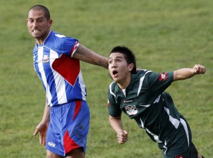 Retaliate: Phil Parker does not appreciate the attention from Ngaruawahia's Tim Kautai. Football NRFL Northern Region Football League 1st Division Papakura City FC v Ngaruawahia AFC Saturday 18th July 2009. Photo Credit: Shane Wenzlick