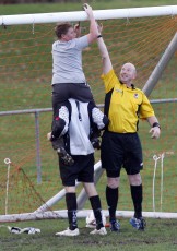 Assistant referee Paul Mason and Ngaruawahia's goal keeper Jonathon Ross enlist a little help in repairing the goal nets at half time. Football NRFL Northern Region Football League 1st Division Papakura City FC v Ngaruawahia AFC Saturday 18th July 2009. Photo Credit: Shane Wenzlick