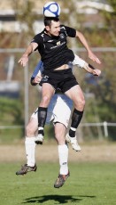 FHM's Kelly Escolme gets to the ball ahead of Ngaruawahia's Mark Phillips. NRFL Northern Region Football League Premier Division, Forrest Hill Milford AFC v Ngaruawahia Utd AFC, Becroft Park, Forrest Hill, Saturday 10th July 2010. Photo: Shane Wenzlick