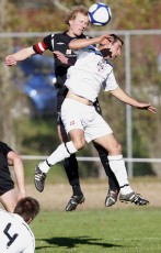 FHM's Mikael Munday wins the ball over Ngaruawahia's Jonathon Stables. NRFL Northern Region Football League Premier Division, Forrest Hill Milford AFC v Ngaruawahia Utd AFC, Becroft Park, Forrest Hill, Saturday 10th July 2010. Photo: Shane Wenzlick