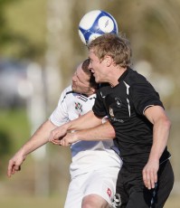 FHM's Paul Rhodes and Ngaruawahia's Glenn Brown go head to head. NRFL Northern Region Football League Premier Division, Forrest Hill Milford AFC v Ngaruawahia Utd AFC, Becroft Park, Forrest Hill, Saturday 10th July 2010. Photo: Shane Wenzlick