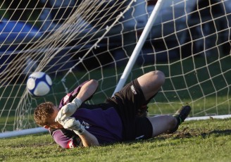 Ngaruawahia's Alex Carr cannot stop the 2nd of two penalties he had to face today. NRFL Northern Region Football League Premier Division, Forrest Hill Milford AFC v Ngaruawahia Utd AFC, Becroft Park, Forrest Hill, Saturday 10th July 2010. Photo: Shane Wenzlick