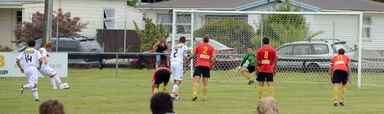 Alex Carr saves a penalty taken by Christchurch's Aaron Clapham