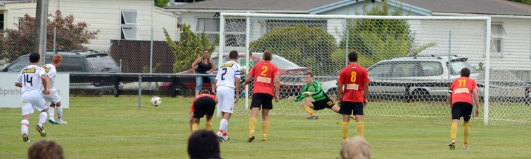 Alex Carr saves a penalty taken by Christchurch's Aaron Clapham